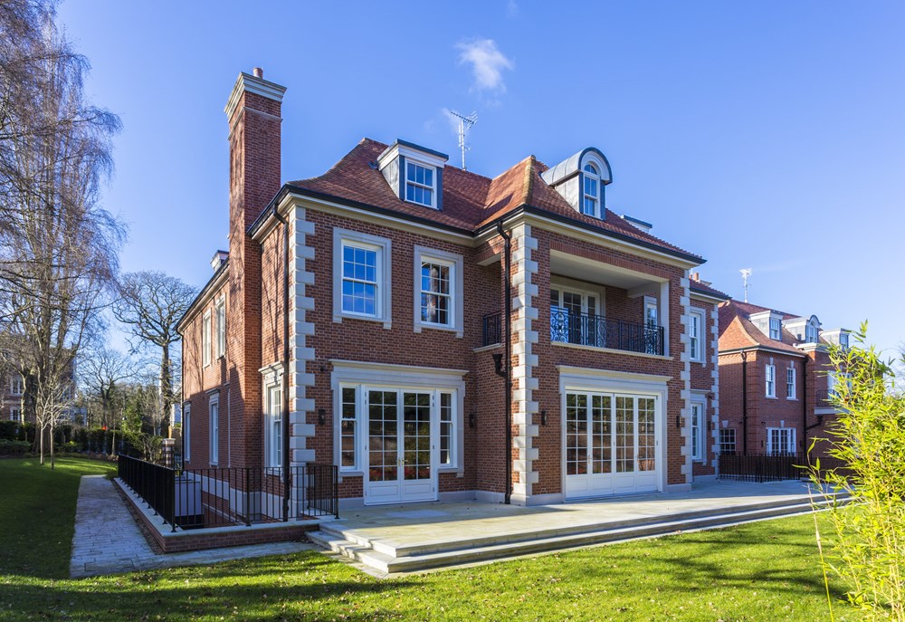 Timber box sash windows installed on a large brick property 