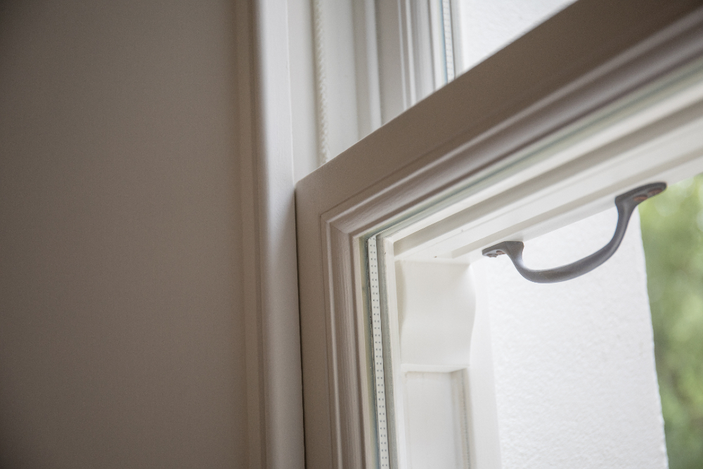 Wooden sash window handle in Notting Hill