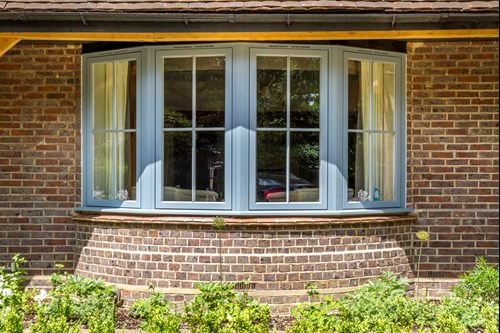 Grey timber bay windows