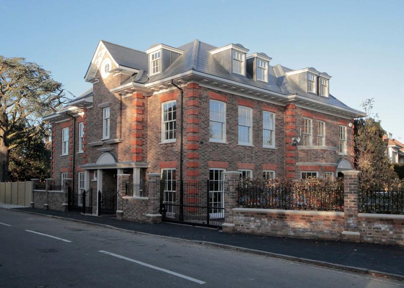 Brick building with white timber sash windows from Lomax + Wood 